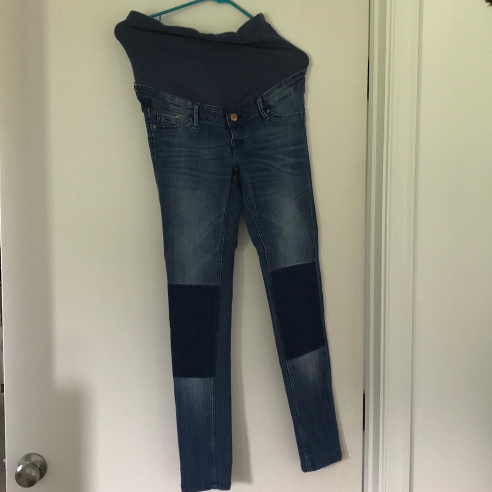Skinny leg maternity jeans with patches.